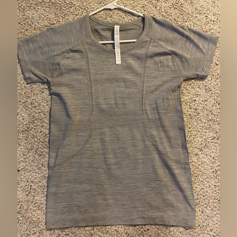 Grey size 10 Lululemon dupe Swiftly Tech t-shit with Lulu logo.
